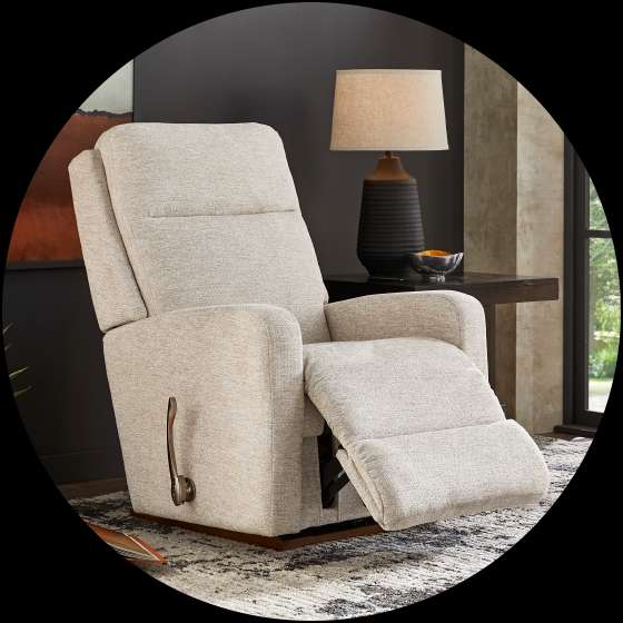 Beige recliner chair with a lever.
