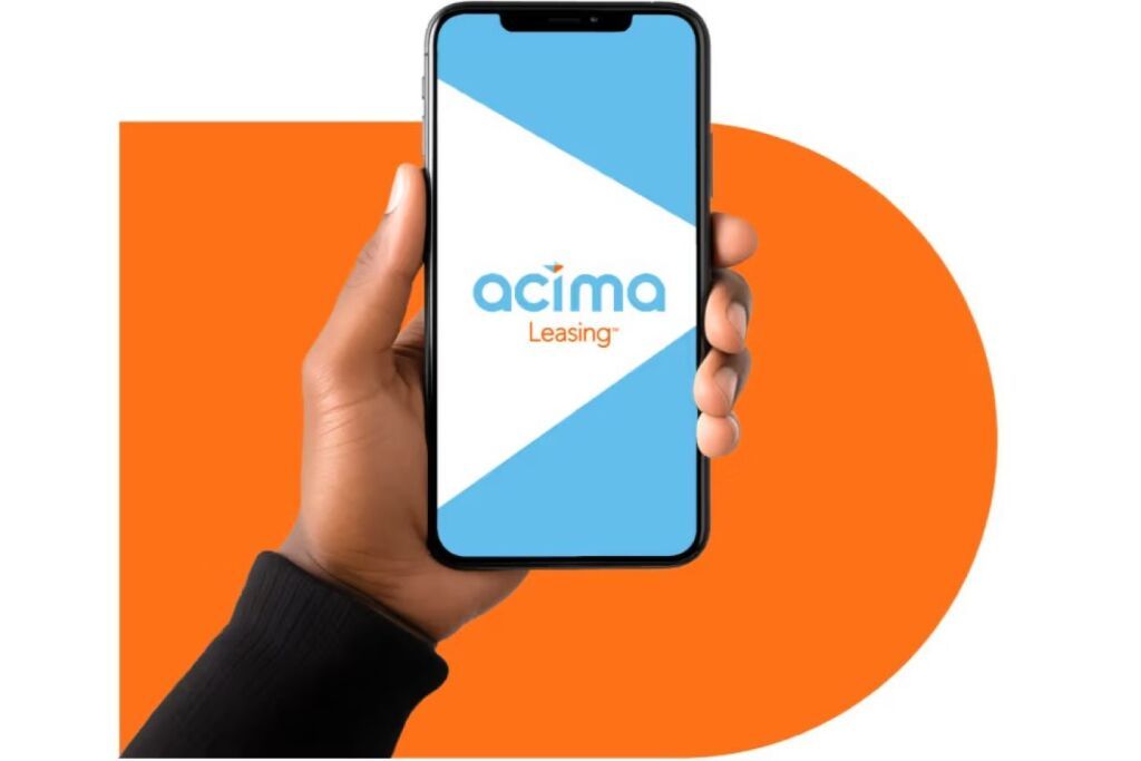 A hand holding a phone displaying the Acima Leasing logo.
