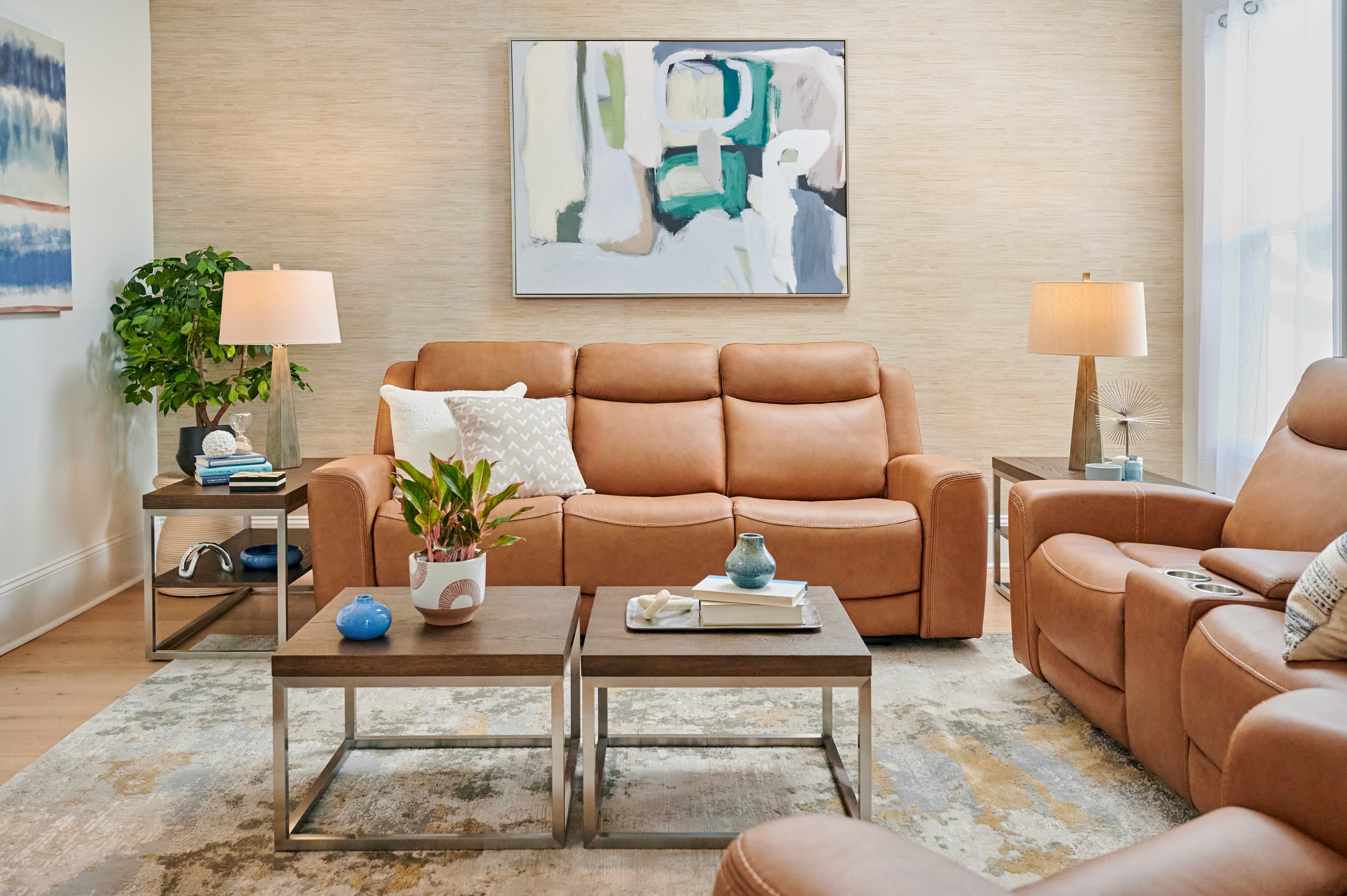 brown couch with coffee table and lamps
