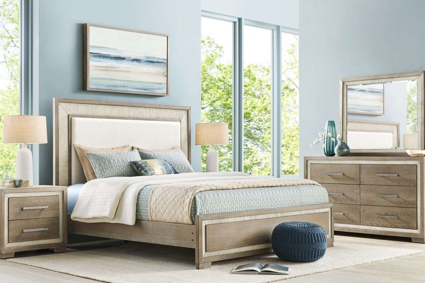 Bedroom furniture set with a bed, dresser, and nightstand.
