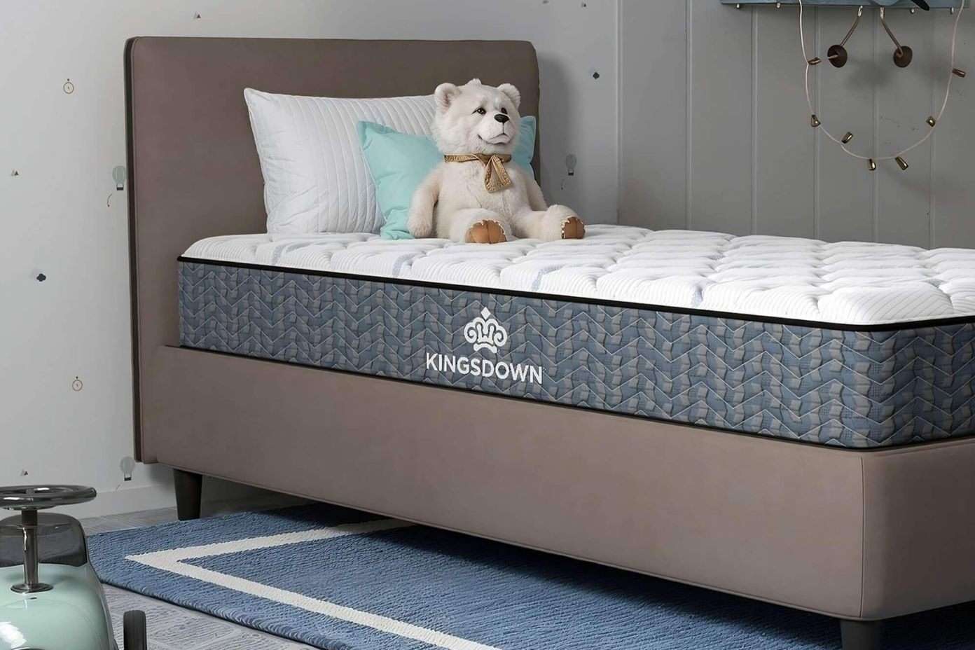Kingsdown mattress with a teddy bear on top.
