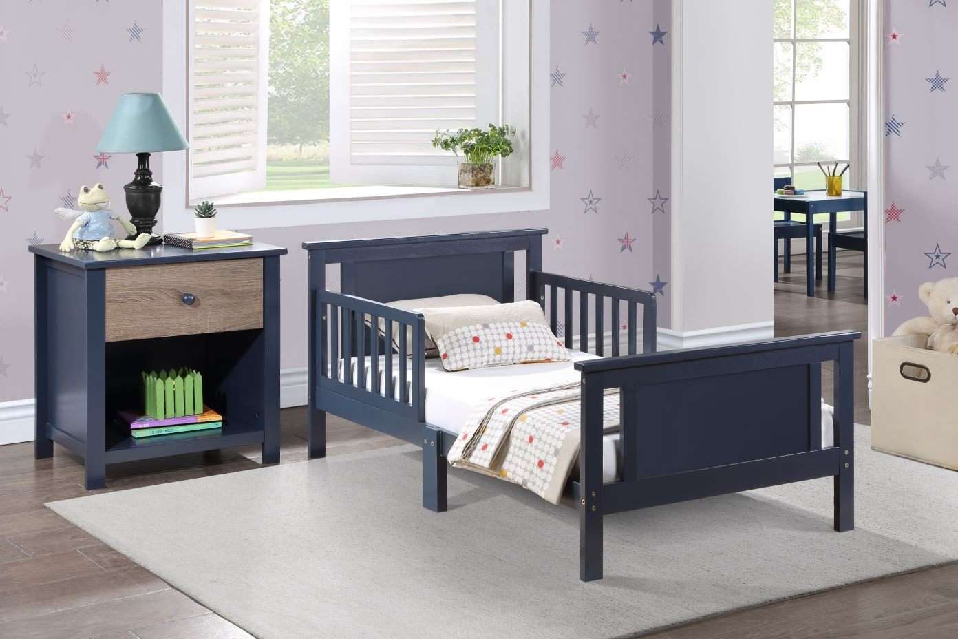A navy blue toddler bed with a matching nightstand in a child's bedroom.