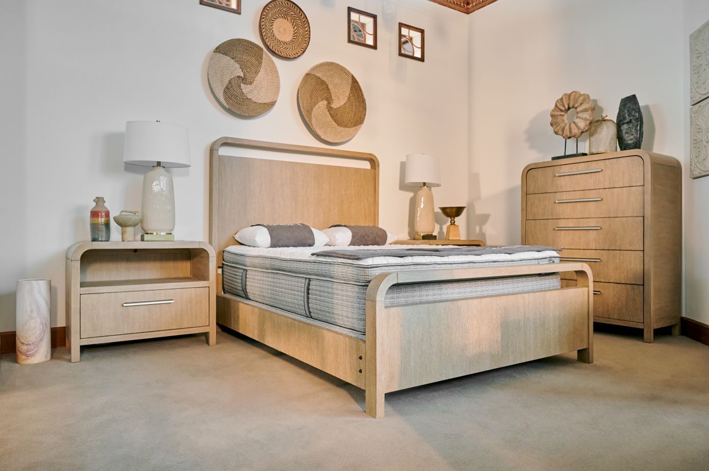Bedroom furniture set with a bed, nightstand, and dresser.
