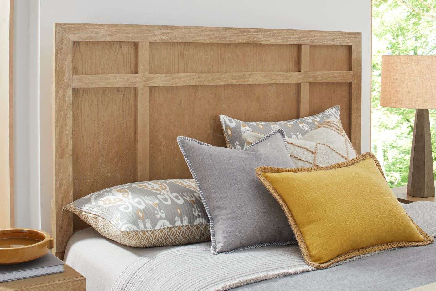 Wooden headboard with pillows.