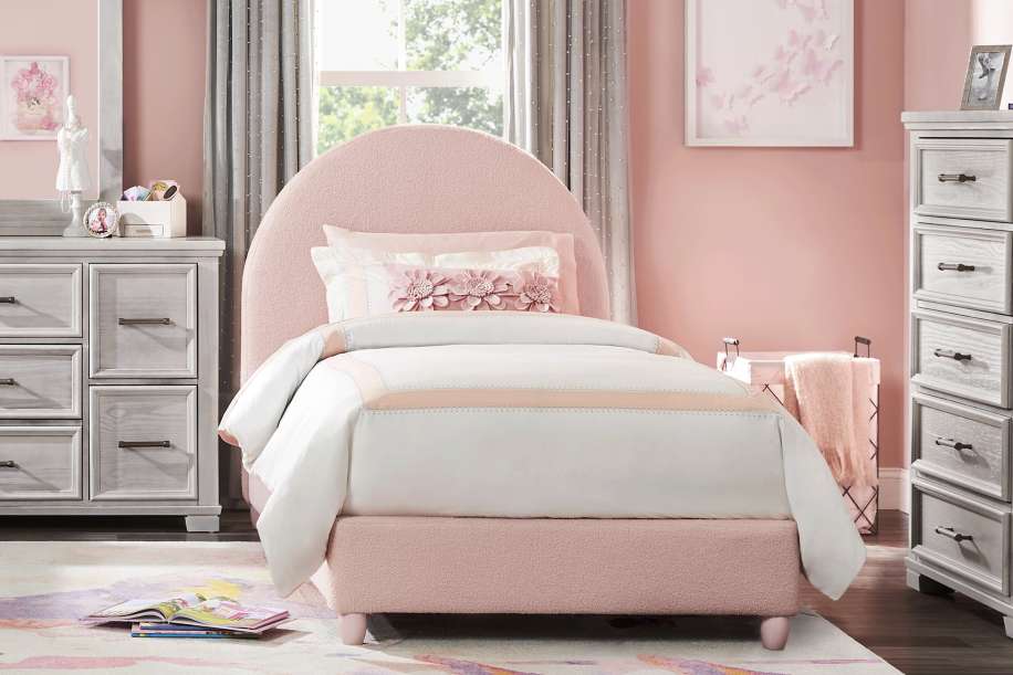 Pink bed in a girl's bedroom.