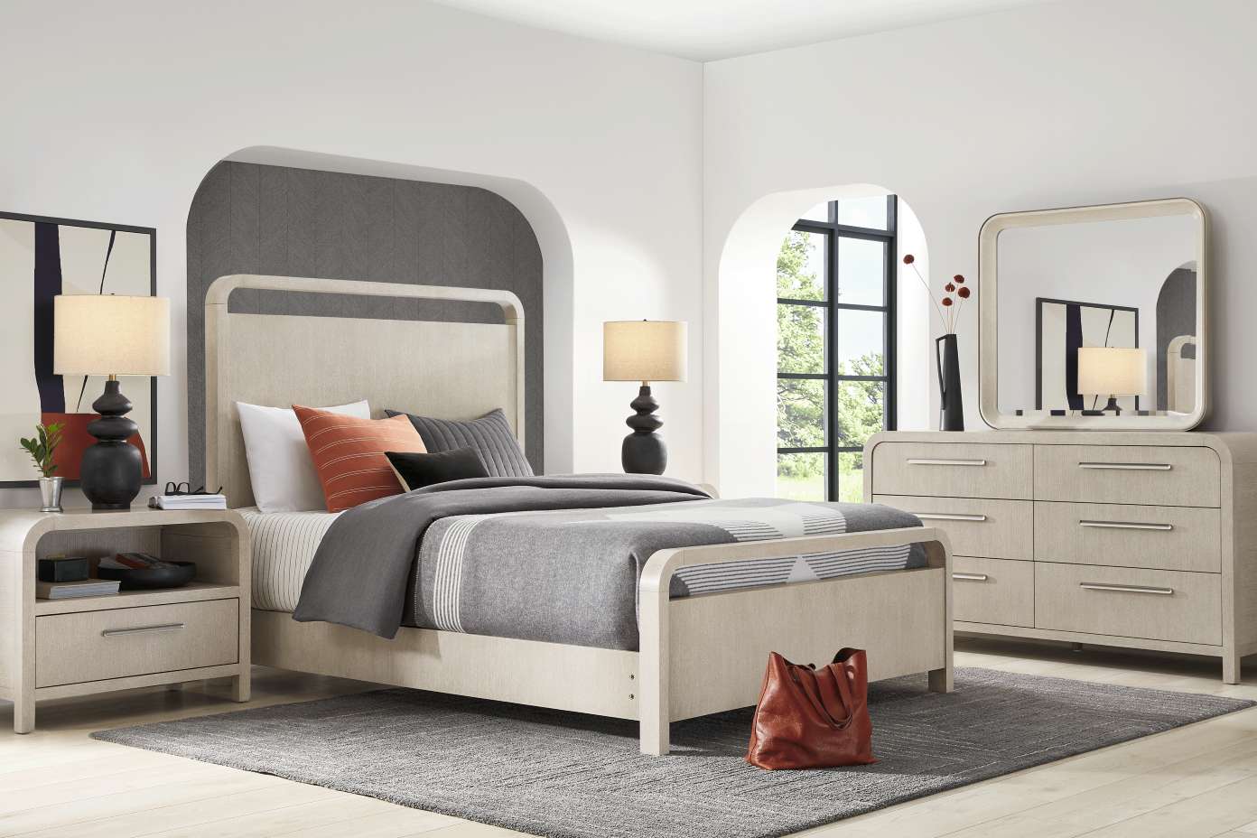 Bedroom furniture set with a bed, nightstand, dresser, and mirror.

