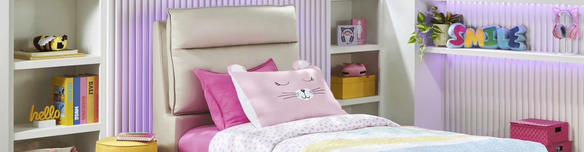 A child's bedroom with a bed, pillows, and shelves.