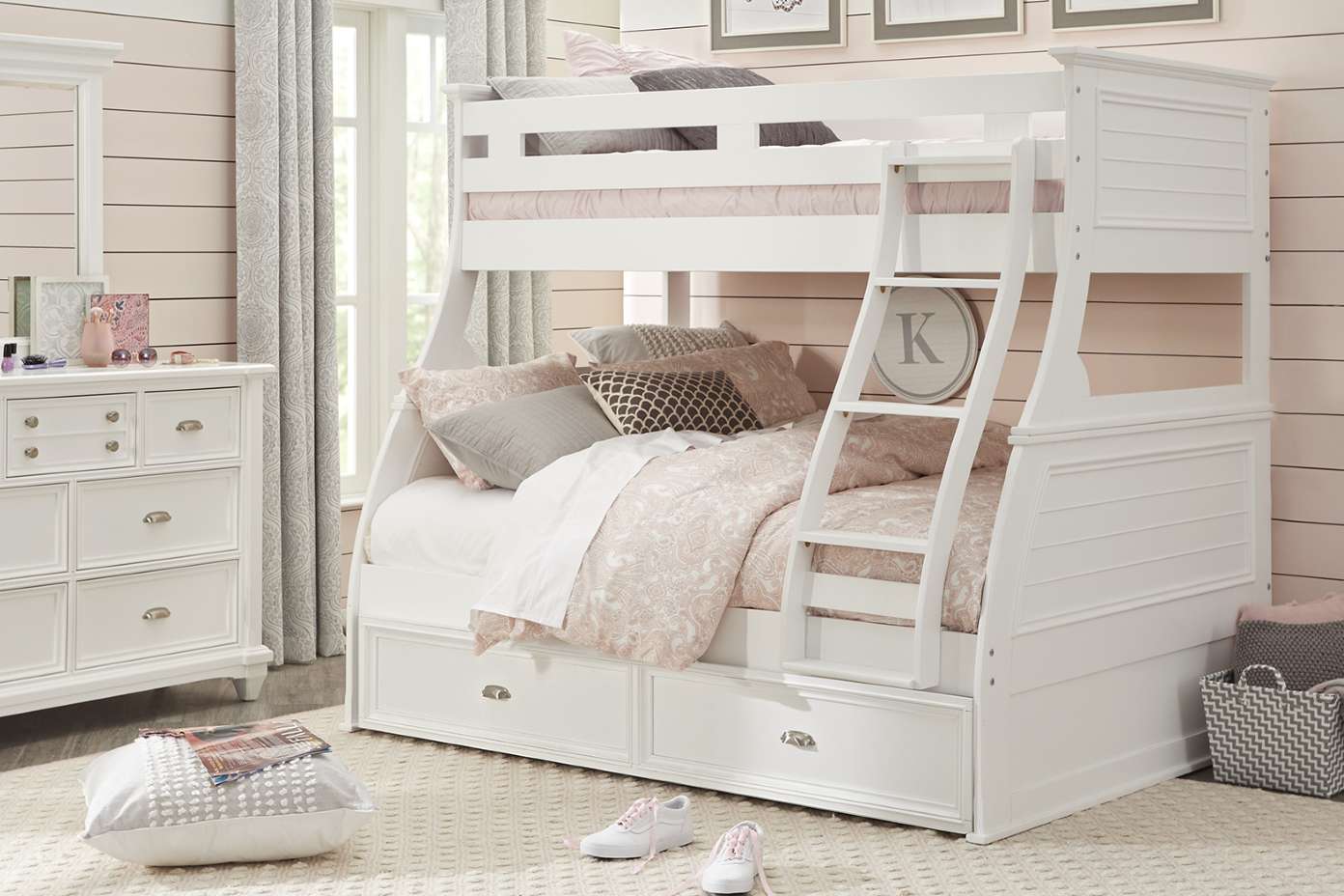 White bunk bed with storage drawers.