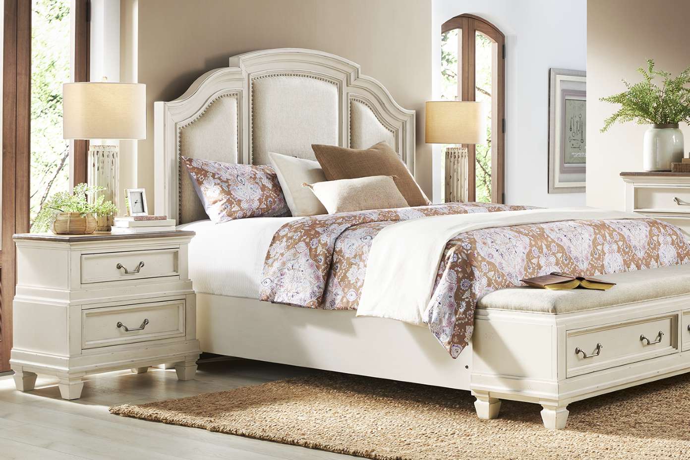 Bedroom set with a bed, nightstands, and a bench.
