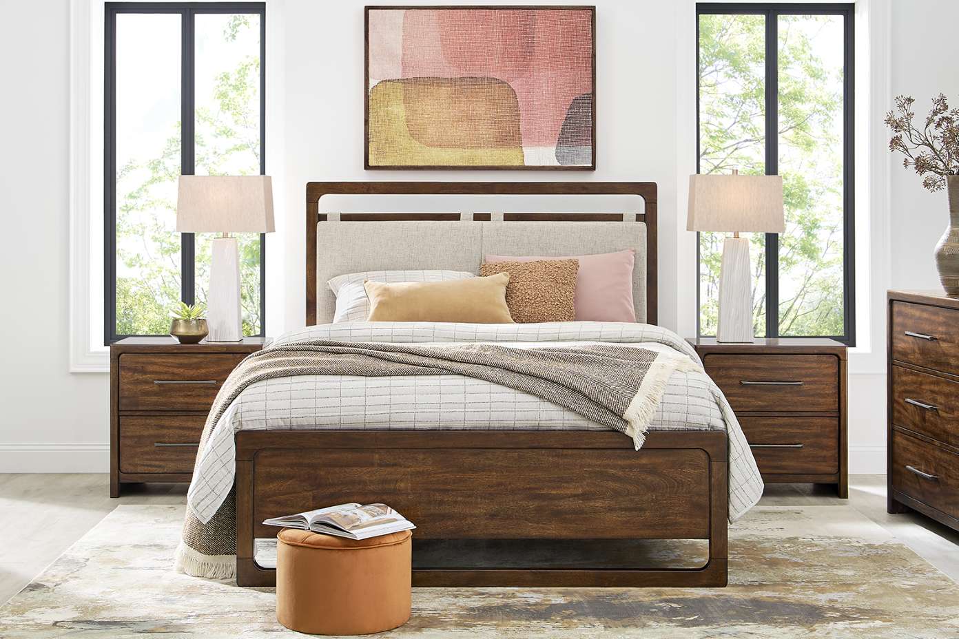 Bedroom furniture set with a bed, nightstands, and a dresser.