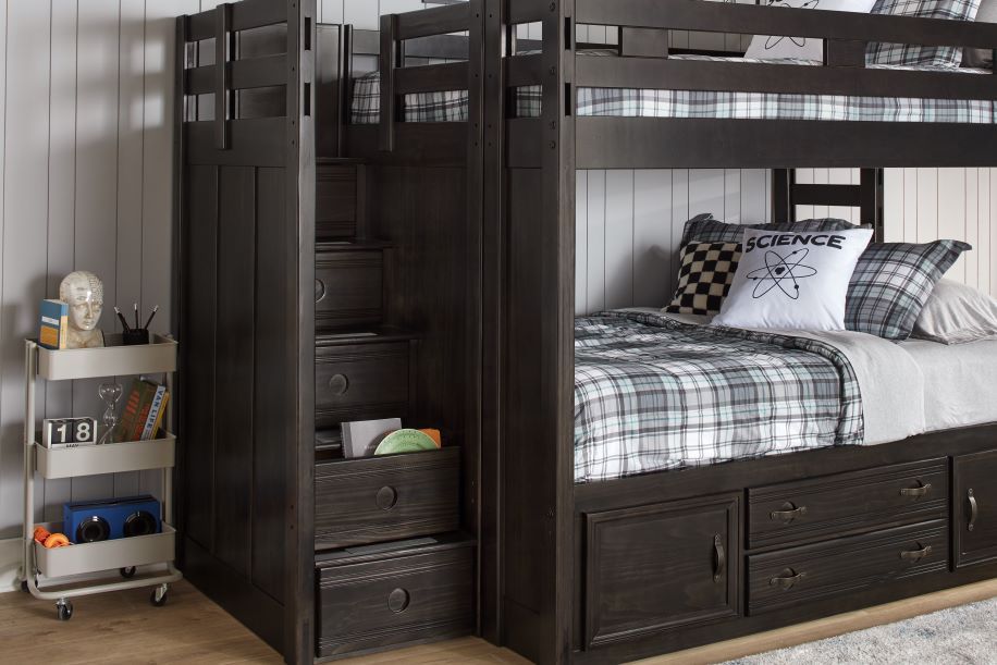 Dark wood bunk bed with stairs and storage drawers.
