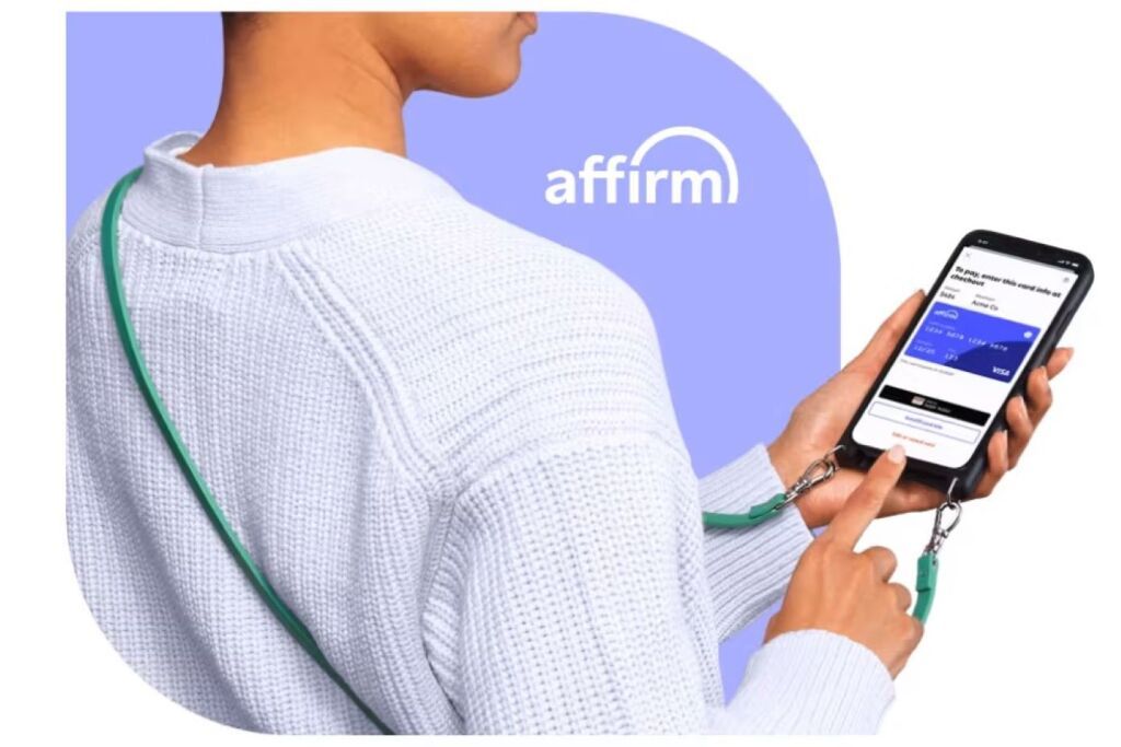 affirm logo; person holding a phone with a credit card on the screen.
