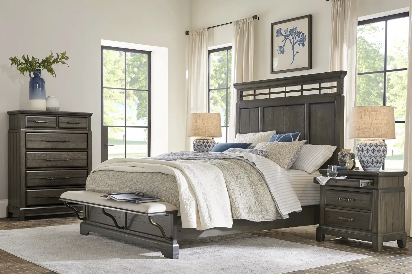 Bedroom furniture set with a bed, nightstand, and dresser.
