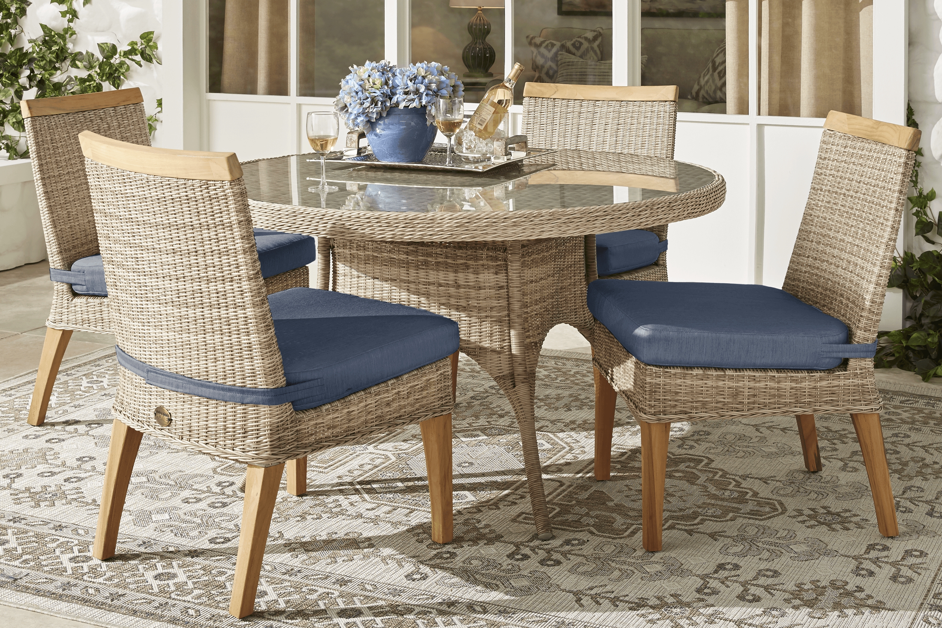 Cindy Crawford Home Hamptons Cove Gray 5 Pc Round Outdoor Dining Set with Denim Cushions - Thumbnail - Image 1