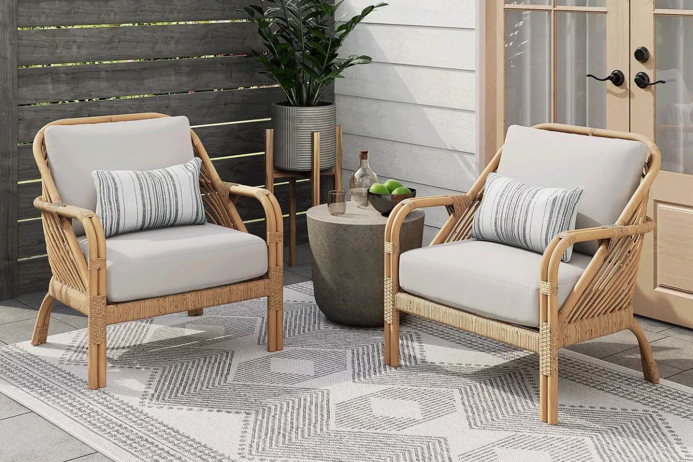 two patio chairs with cushions 