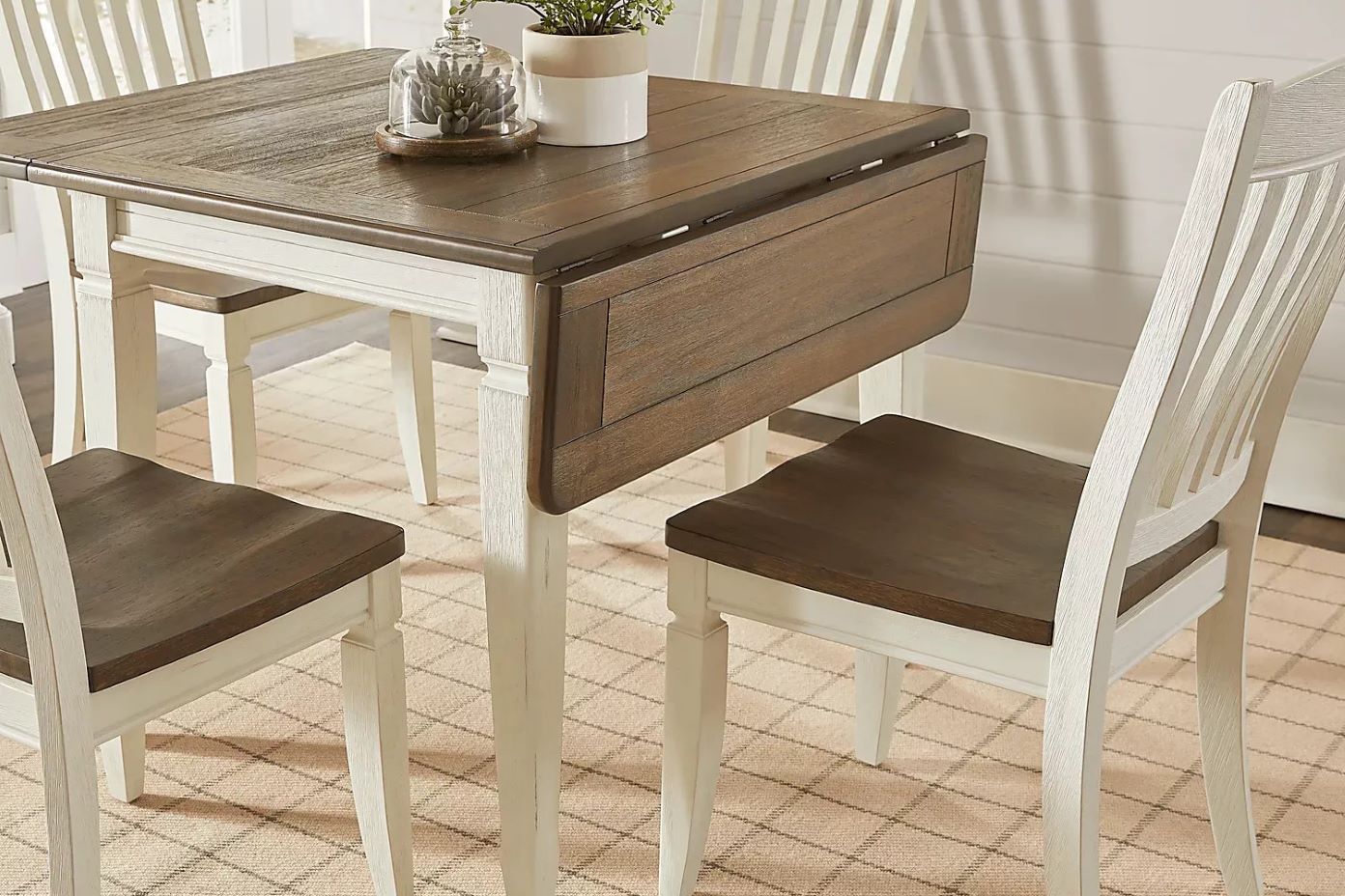 Dining table with drop leaf and chairs.
