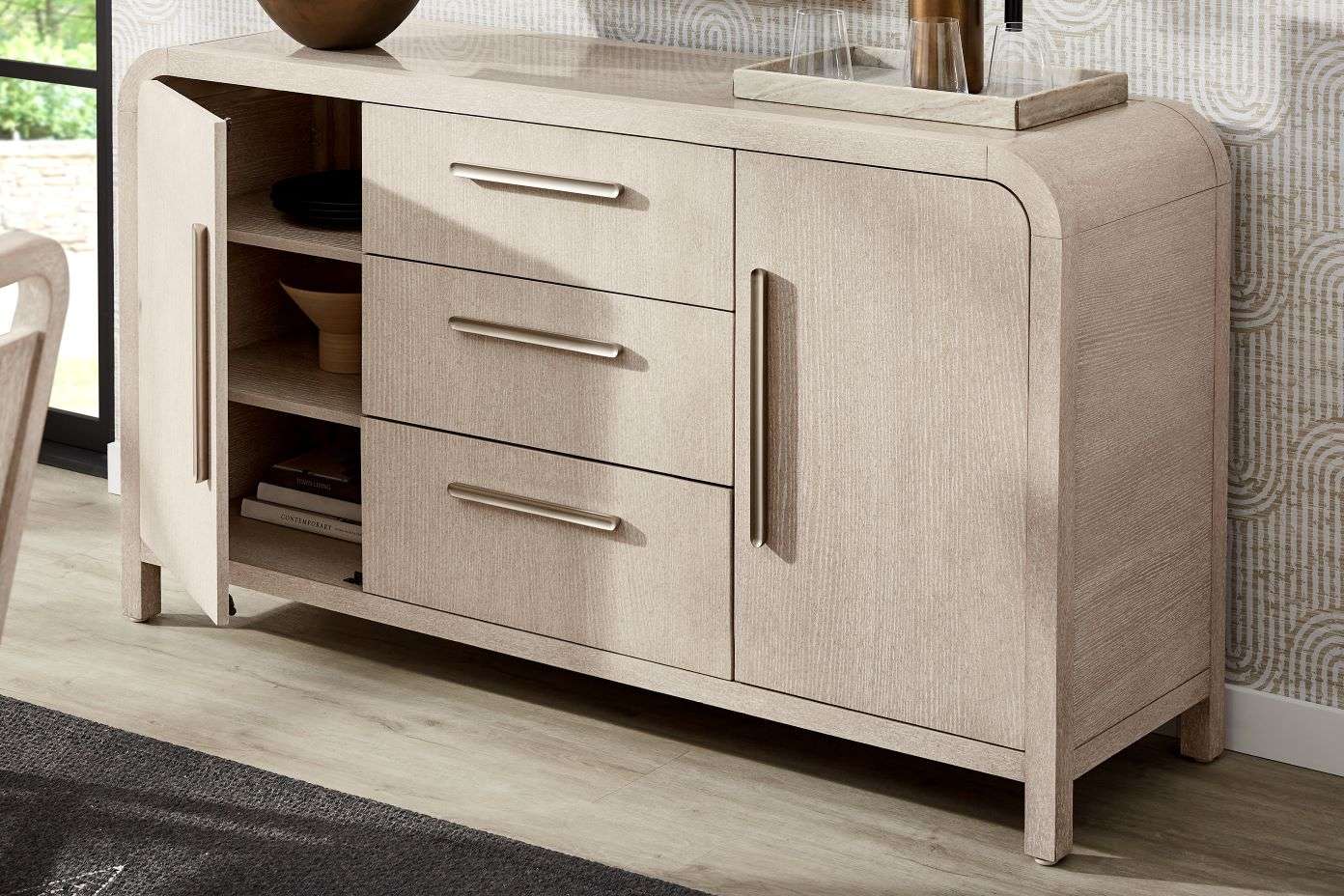 Light wood sideboard with drawers and cabinet.
