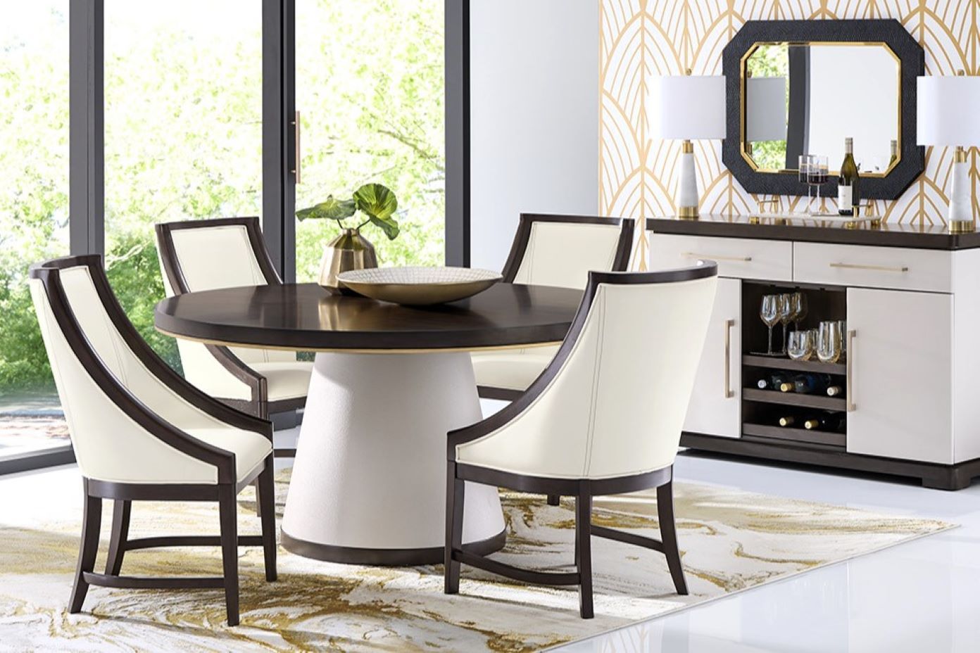 Dining room set with a round table and chairs, and a sideboard.
