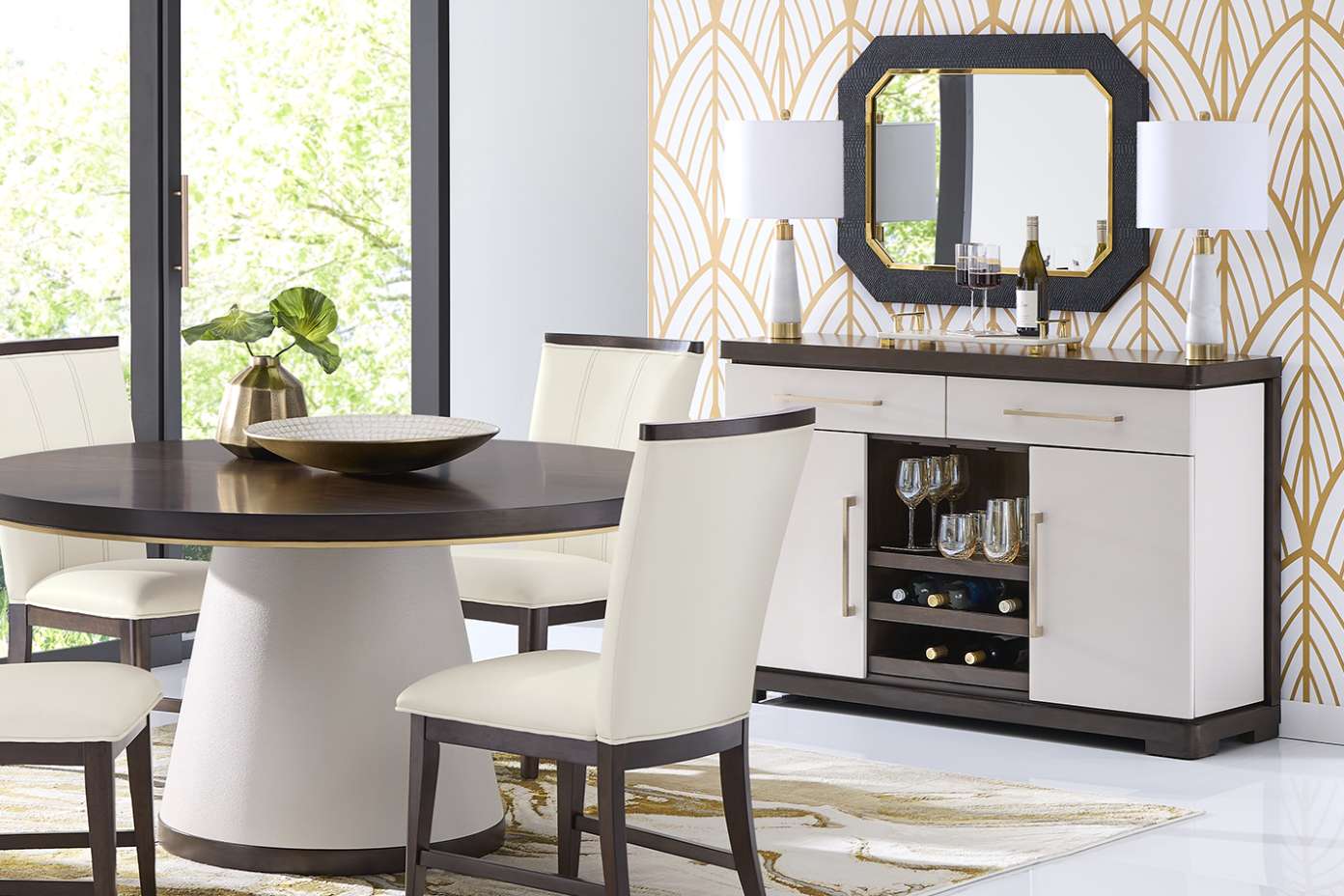 Dining room furniture set with a round table, chairs, and a sideboard.

