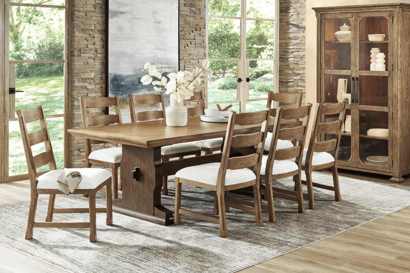 Wooden dining table with chairs and a cabinet.