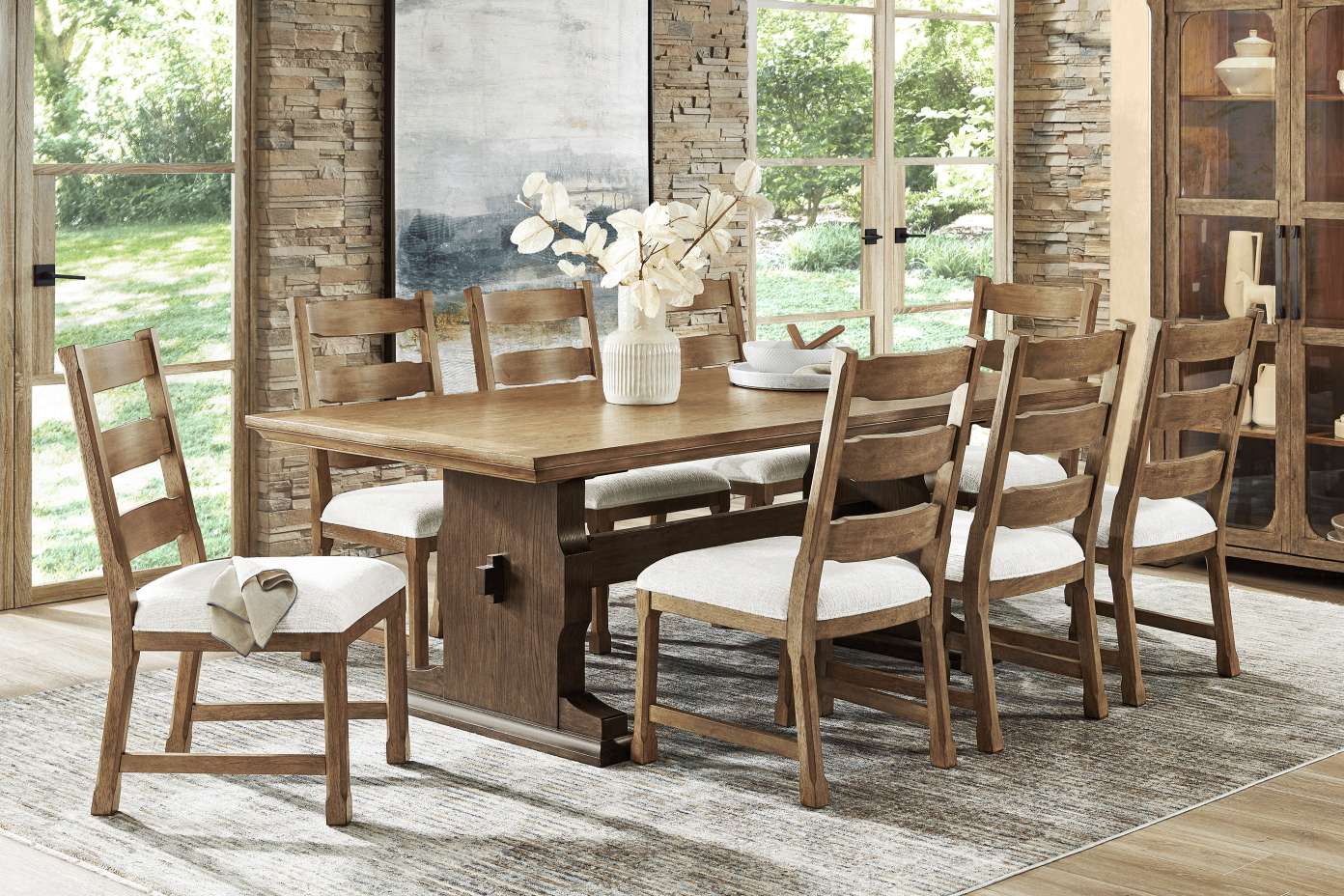 Dining room set with a wooden table and chairs.
