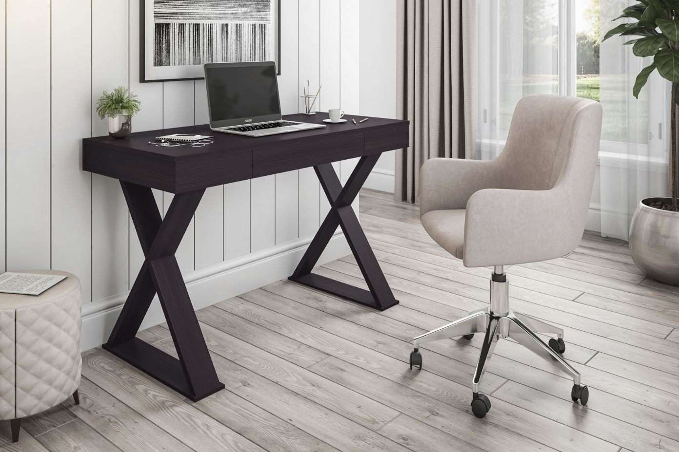Dark wood desk with X-shaped legs, laptop, and a beige office chair.
