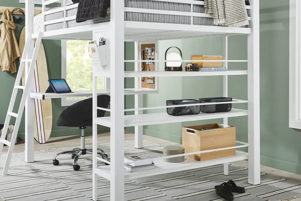 White loft bed with desk and shelves.
