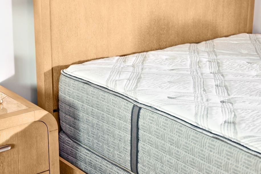 mattress and tan headboard