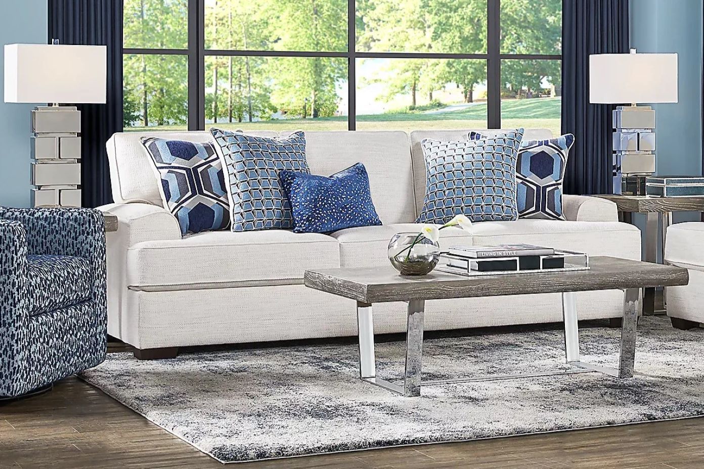cream colored couch with dark pillows