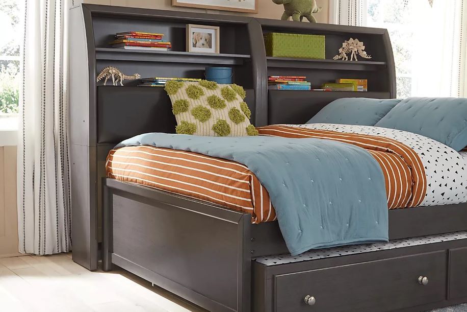 a daybed and desk with storage