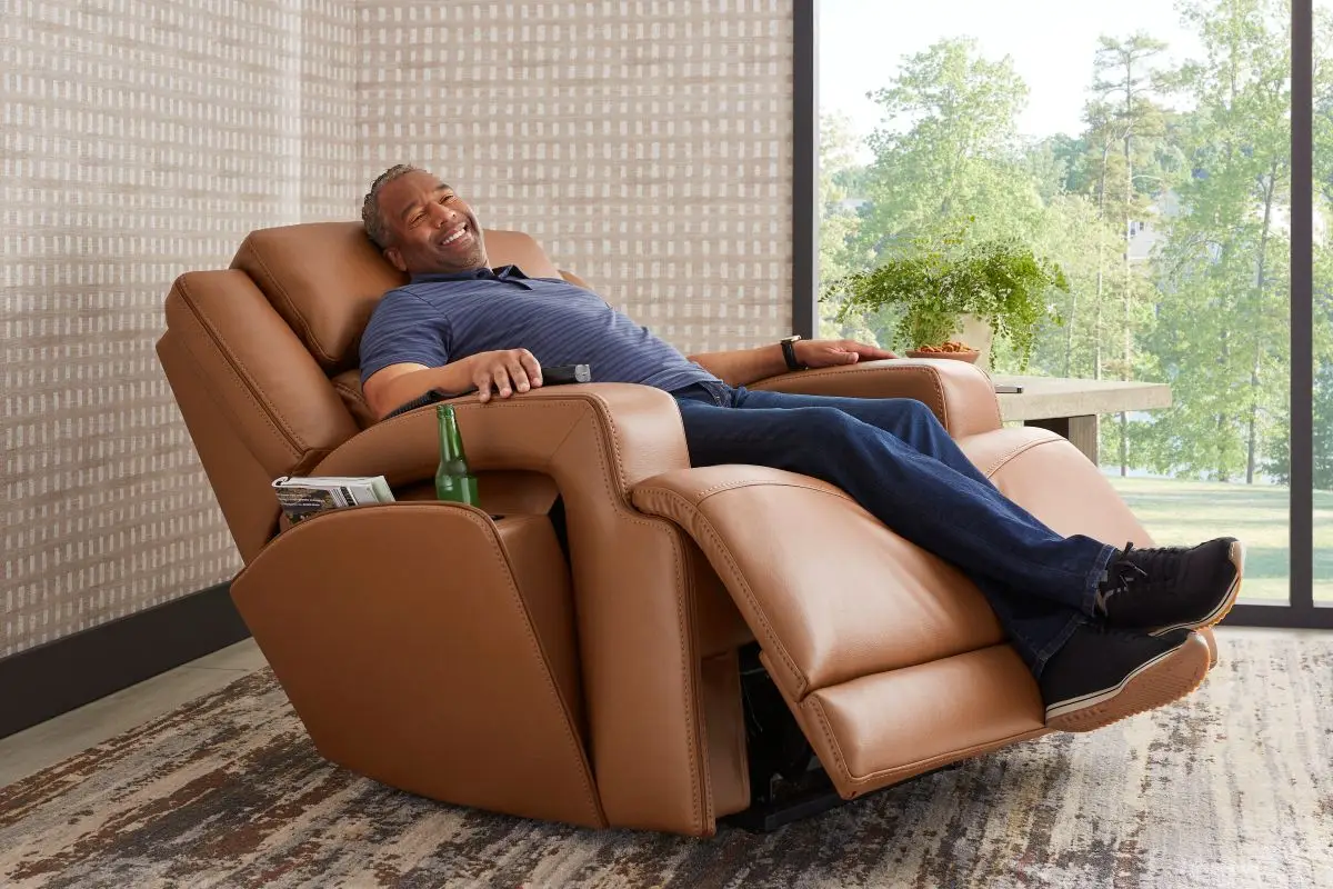 Man lounging in oversized leather recliner chair