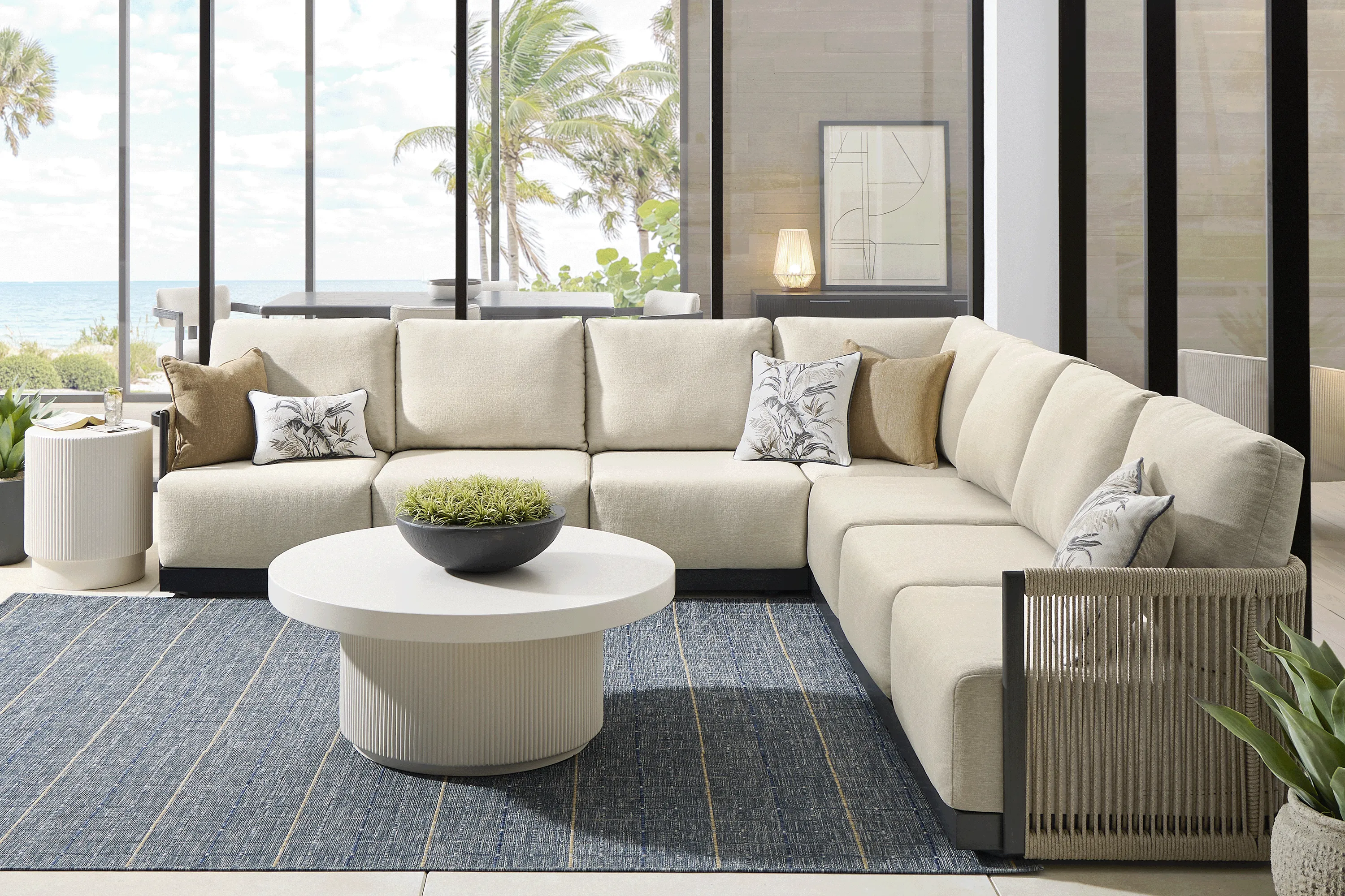 Lanai Black 7 Pc Outdoor Sectional with Cream Cushions - Image 1