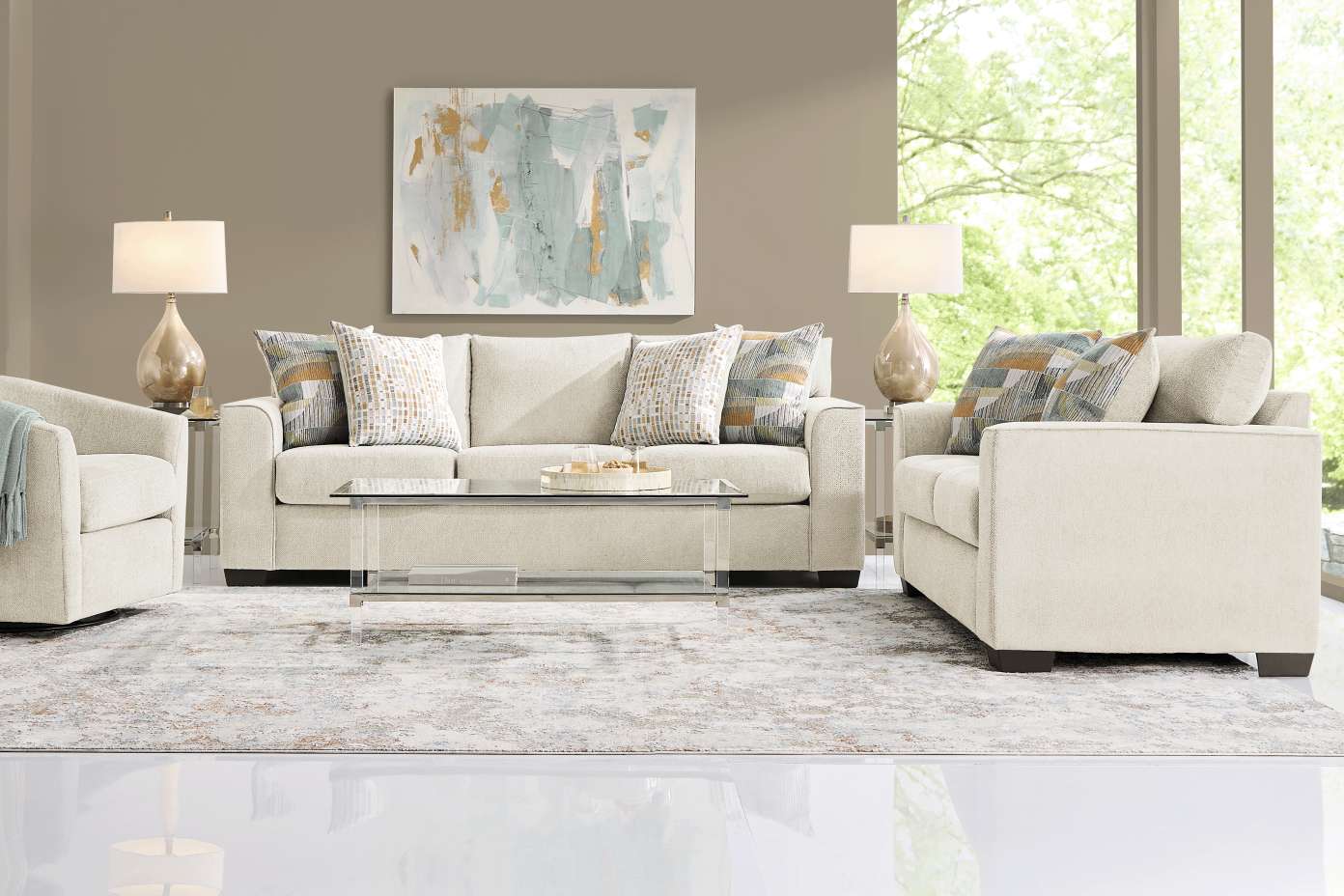 Living room furniture set with a sofa, two armchairs, and a glass coffee table.
