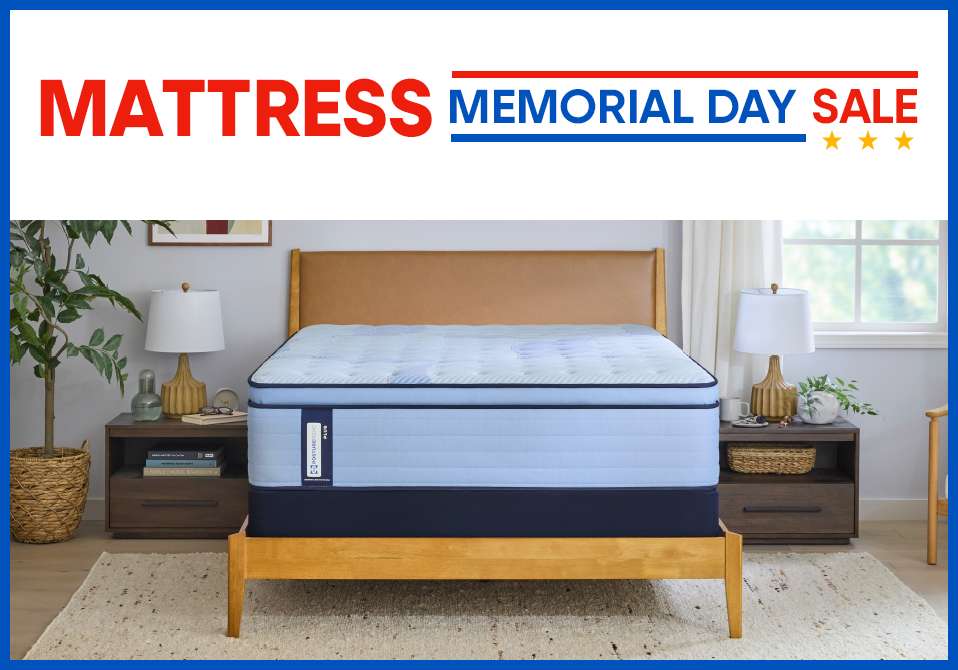 MATTRESS MEMORIAL DAY SALE. A light blue mattress on a wooden bed frame.
