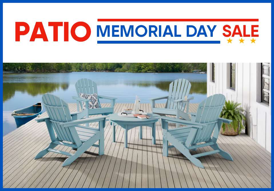 PATIO MEMORIAL DAY SALE. Four blue Adirondack chairs around a small table on a wooden deck by a lake.
