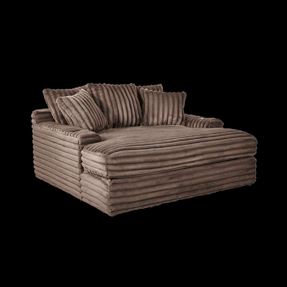 Brown corduroy chaise lounge with pillows.
