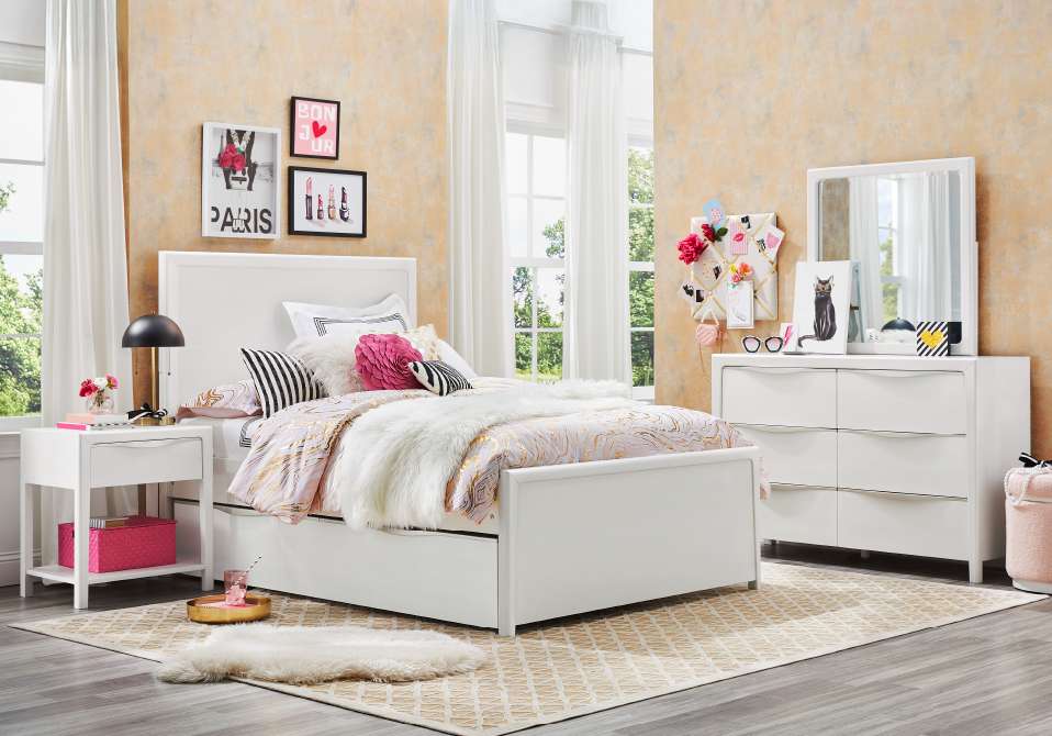 White bedroom furniture set with decorative accents.

