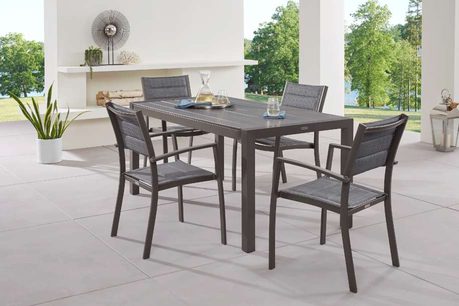 Outdoor dining set with a gray table and chairs.
