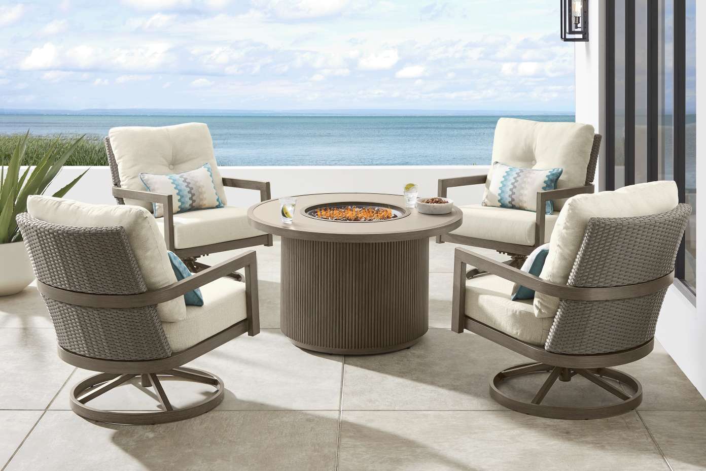 Outdoor seating set with a fire pit table.