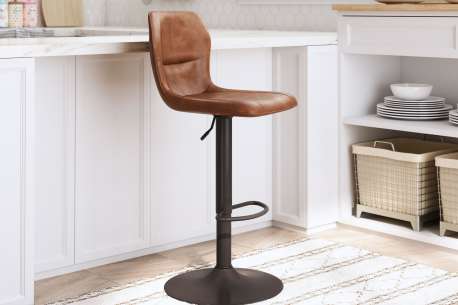 Brown leather bar stool in a kitchen.
