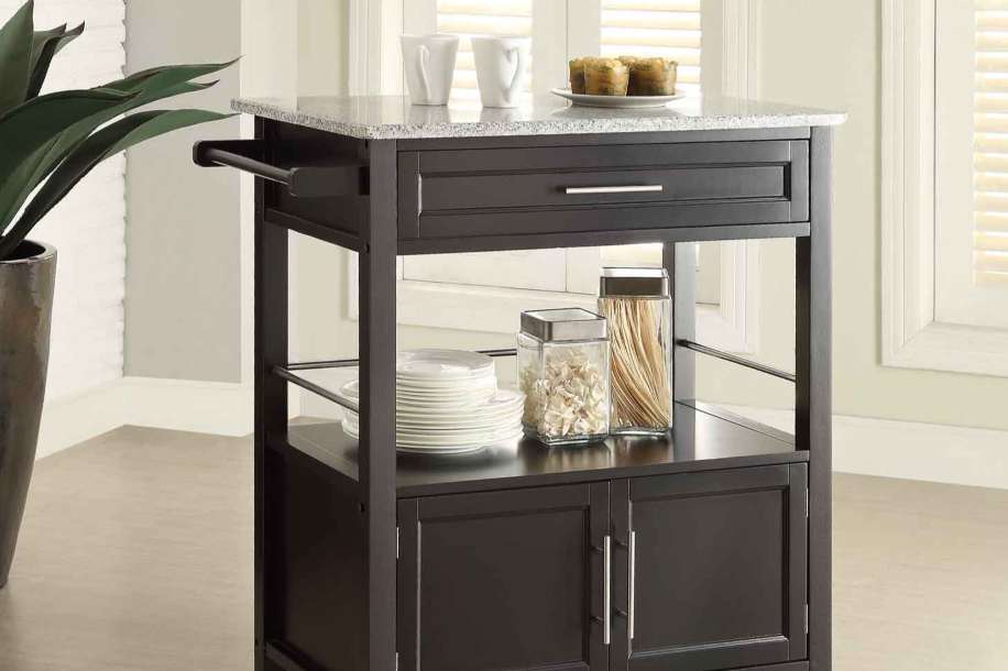 Dark brown kitchen island with a granite countertop.
