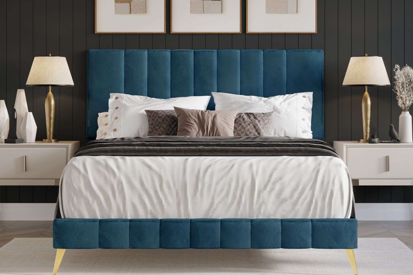 Blue upholstered bed with gold legs, lamps, and nightstands.
