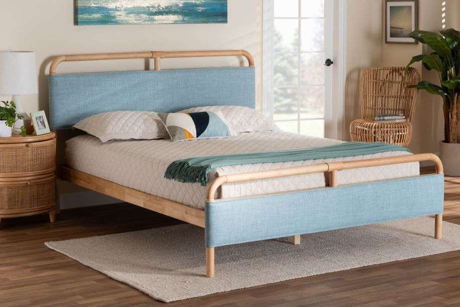 Light blue upholstered bed frame with a light-colored wooden frame and headboard.
