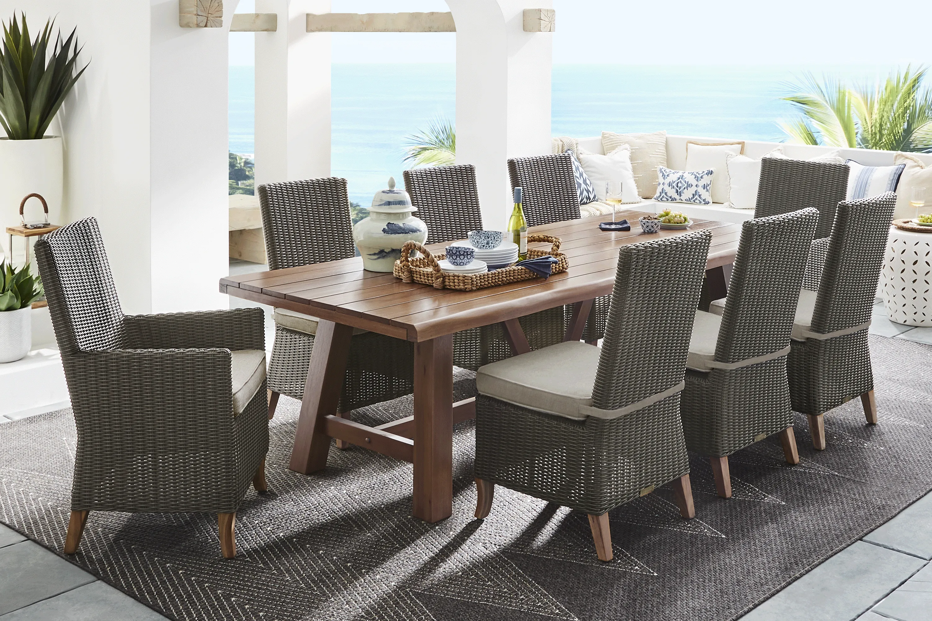 Patmos Tan 9 Pc 102 in. Rectangle Outdoor Dining Set With Mushroom Cushions - Thumbnail - Image 1