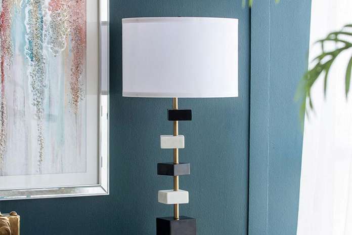 black and white lamp on a table