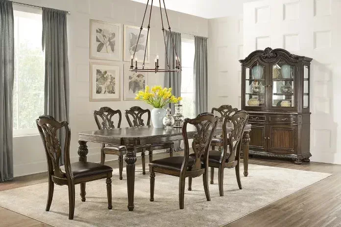 dark brown dining room table with blue chairs