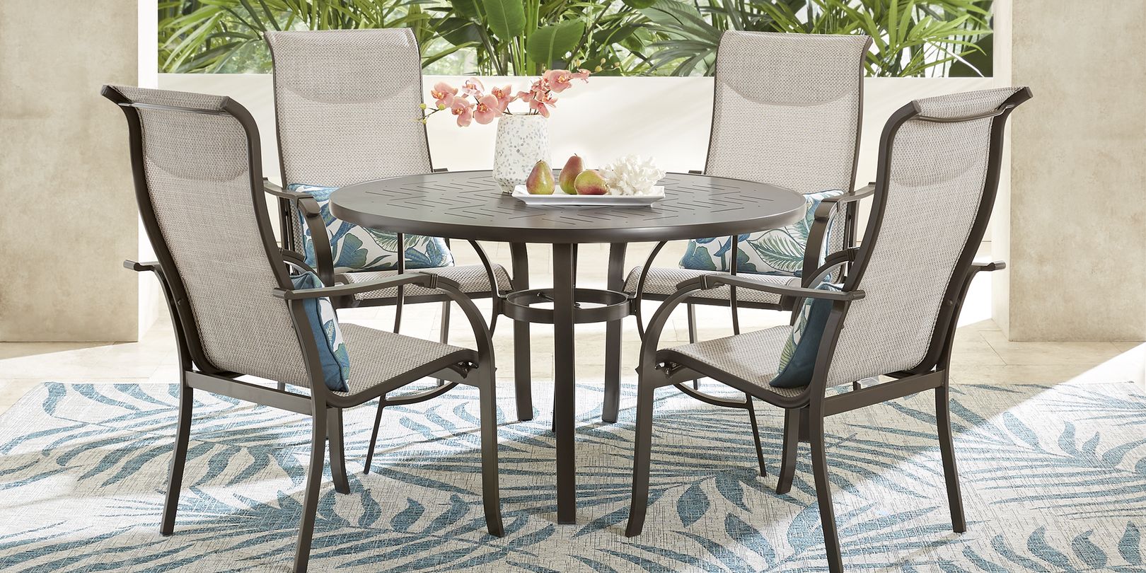 photo of round metal dining table and chairs